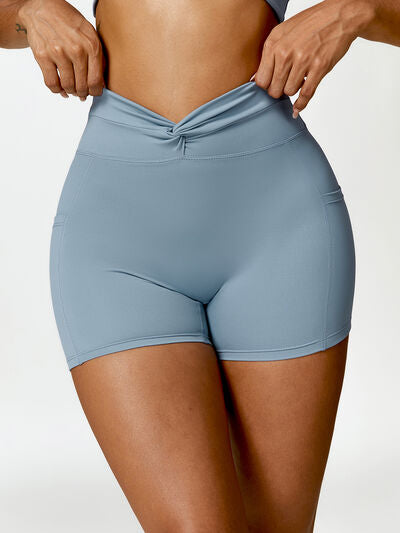 TWISTED HIGH WAIST ACTIVE SHORTS WITH POCKETS