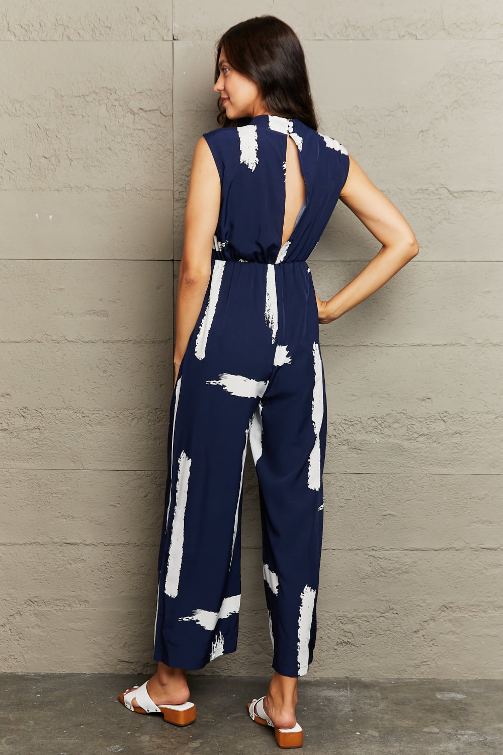 PRINTED ROUND NECK CUTOUT JUMPSUIT WITH POCKETS