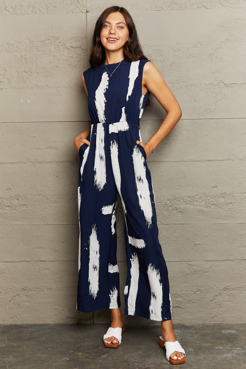 PRINTED ROUND NECK CUTOUT JUMPSUIT WITH POCKETS